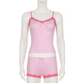 Pink polka dot camisole and shorts set on a mannequin